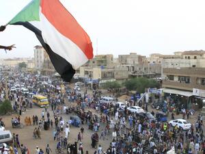 Crowds of protesters were violently dispersed by men in military fatigues in a pre-dawn raid on a protest site outside army headquarters on June 3. (EBRAHIM HAMID / AFP)