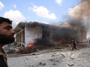 Syrian civilians react following an airstrike by Syrian regime forces in Maar Shurin on the outskirts of Maaret al-Numan in northwest Syria  (AFP)