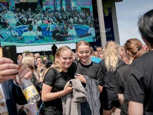 Jehovah's Witnesses react after receiving the baptism during a group baptism event during an international convention at Broendby Stadium on July 20, 2019 in Copenhagen.  Ida Marie Odgaard / Ritzau Scanpix / AFP