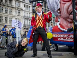 Anti-Brexit campaigners dressed as US President Donald Trump (R) and Conservative party leadership contender Boris Johnson take part in the March for Change 'No to Boris:Yes to Europe' demonstration in central London on July 20, 2019. (Tolga Akmen / AFP)