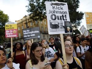 Demonstrators carry placards as they protest against Britain's newly appointed prime minister Boris Johnson outside Downing Street in London on July 24, 2019. (AFP/ File Photo)