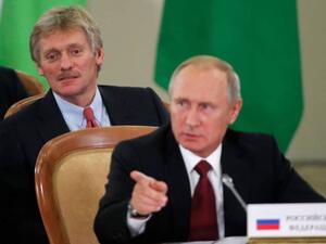 Russia's President Vladimir Putin (front) and Kremlin spokesman Dmitry Peskov attend a session of the Council of Heads of the Commonwealth of Independent States (CIS) in Sochi. (AFP/ File Photo)