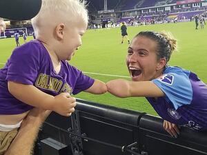 Little 18-month-old Joseph Tidd (left) who was born without his left hand has warmed hearts everywhere after he 'fist bump' his limb with football star Carson Pickett (right) who suffers from the same condition. (Instagram)