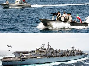 This combination of file pictures created on July 22, 2019, shows Iranian soldiers taking part in the "National Persian Gulf day" in the Strait of Hormuz, on April 30, 2019 (up) and the amphibious assault ship USS Boxer (LHD 4) receiving a vertical replenishment-at-sea in the Arabian Sea on July 14, 2019. (US Navy photo via AFP)