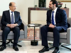 Lebanese President Michel Aoun (L) speaking with Prime Minister Saad al Hariri during a meeting at the Presidential Palace in Baabda, east of the capital Beirut. (AFP)