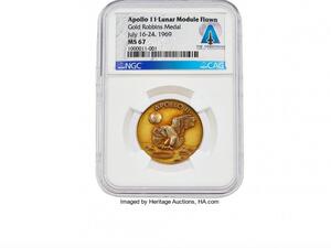 A gold medal Neil Armstrong carried while landing on the moon in the Apollo 11 mission sold for more than $2 million in an auction on Wednesday. (Photo courtesy Heritage Auctions )