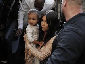 Kim Kardashian with North West. (Ahmad Gharabli / AFP)