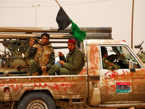 Libyan rebels travel to a battle (Shutterstock)	