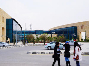 A group of students walking home from a new modern building of Jordan University Of Science and Technology(JUST) in a cold winter evening.  (Shutterstock/ File Photo)