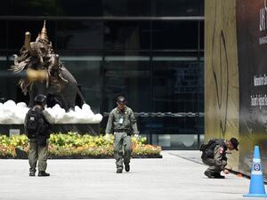 Members of the explosive ordinance disposal unit gather at the scene of an explosion in Bangkok  (AFP)
