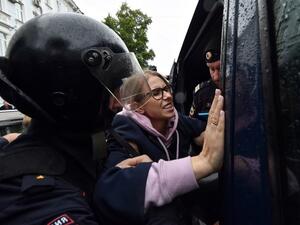 Police officers detain opposition politician, would-be candidate Lyubov Sobol on her way to an unsanctioned rally urging fair elections in downtown Moscow (AFP)