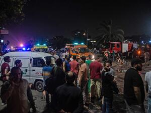 Onlookers gather during the night of August 5, 2019, at the scene of an accident that took place just before midnight (AFP)