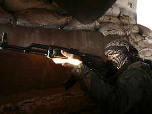 A Turkish-backed Syrian fighter poses in Tadef, near the city of al-Bab, in the eastern countryside of Aleppo province on August 6, 2019.  (Nazeer Al-khatib / AFP)