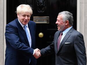 Britain's Prime Minister Boris Johnson (L) greets King Abdullah II of Jordan outside 10 Downing Street in London on August 7, 2019, ahead of bilateral talks and a working lunch.  (Daniel LEAL-OLIVAS / AFP)