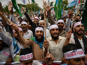 Supporters of the Pakistani political and Islamic party Jammat-e-Islami (JI) shout slogans as they march during an anti-Indian protest rally in Islamabad  (AFP)