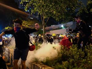 Police in Hong Kong fired volleys of tear gas on August 11 at thousands of pro-democracy protesters who defied warnings from authorities to hit the streets for the tenth weekend in a row. (Manan VATSYAYANA / AFP)
