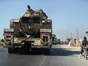 A convoy of Turkish military vehicles passes through the town of Saraqeb in the northwestern province of Idlib reportedly heading toward the town of Khan Sheikhun in the southern countryside of the province on August 19, 2019. (AFP/ File Photo)