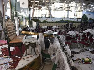 Afghan men investigate in a wedding hall after a deadly bomb blast in Kabul. (AFP/ File Photo)