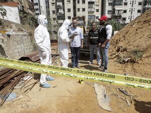 Forensic investigators of Lebanon's military intelligence inspecting the scene where two drones came down in the vicinity of a media centre of the Shiite Hezbollah movement earlier in the day in the south of the capital Beirut. (AFP/ File Photo)