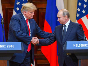 US President Donald Trump shakes hands with Russian President Vladimir Putin at the end of their summit in Helsinki, Finland, on Monday, July 16. (Yuri Kadobnov/AFP/Getty Images)