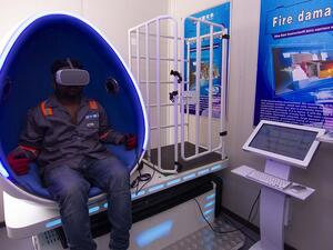 Construction workers experience simulated hazard - management training in the Virtual Reality Pods at DAMAC's AYKON City.