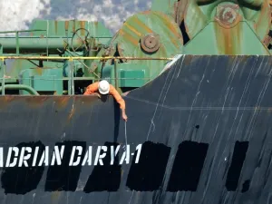 A crew member checks the new name of Iranian oil tanker Adrian Darya, formerly known as Grace 1, off the coast of Gibraltar. The United States on August 30, 2019. (AFP/ File Photo)