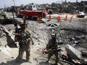 Afghan security forces walks as municipal workers gather to clean up near the crater from where a tractor packed with explosives exploded the night before at the Green Village in Kabul on September 3, 2019. (AFP/ File Photo)