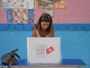 A Tunisian voter fills her ballot for presidential election at a polling station in La Marsa on the outskirts of the capital Tunis, on September 15, 2019. (AFP/ File Photo)