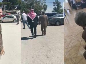 King Abdullah is seen walking in the parking lot of the north Amman Department of Land and Survey during an undercover visit recently (jordantimes)