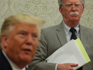 Trump (L), Bolton two faces of US foreign policy 