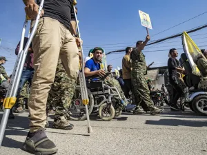 Fighters and veterans from the Kurdish women's protection units (YPJ) and the people's protection units (YPG) march in front of the UN headquarters in the northern Kurdish Syrian city of Qamishli during a protest against Turkish threats in the Kurdish region, on October 8, 2019. (AFP/ File Photo)