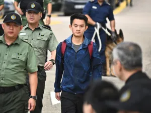 Chan Tong-kai, 20, wanted in Taiwan for the murder of his pregnant girlfriend during a holiday the two Hong Kongers took there in 2018, walks out the Pik Uk Prison in Hong Kong on October 23, 2019, after serving a short jail sentence for stealing his girlfriend's possessions. (AFP/ File Photo)