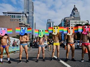 Participants pose with stylised rainbow elephant masks as they take part in the annual gay pride parade in Taipei on October 26, 2019. Thousands including members of the LGBT community on October 26 took part in the first gay pride parade held after Taiwan earlier this year legalised same-sex marriages, the culmination of a three-decade fight for equality. Sam YEH / AFP