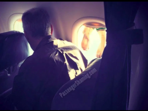 An unidentified plane passenger is leaving netizens disgusted after he was captured drying his socks by wedging them in the plane's window shutter. (Photo: Passenger Shaming/Instagram)