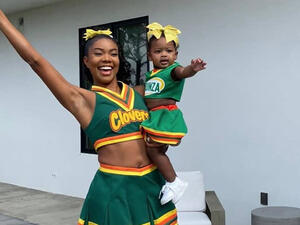 She completed the fun look with white trainers and socks pulled up her calves.