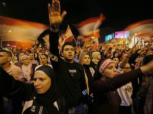 Lebanese protesters wave flags and shout slogans during an anti-government demonstration at al-Nour Square in the northern port city of Tripoli on November 2, 2019. Ibrahim CHALHOUB / AFP