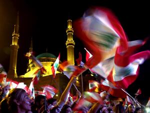 Lebanese protesters wave the national flag during an anti-government demonstration in downtown Beirut, on November 3, 2019. Unprecedented cross-sectarian demonstrations have gripped Lebanon since October 17, demanding a complete overhaul of a political system deemed inefficient and corrupt. Patrick BAZ / AFP