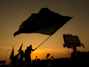 Iraqi protesters wave a flag during a demonstration during ongoing anti-government demonstrations in the southern city of Basra, on November 13, 2019. (AFP/ File Photo)
