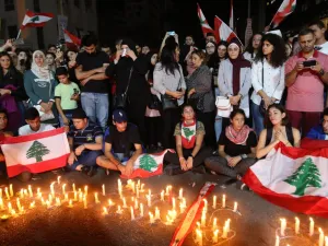Lebanese demonstrators hold a candle light vigil in the the southern Lebanese city of Sidon (Saida) on November 13, 2019, for Alaa Abu Fakhr (photo), killed the day before during ongoing anti-government protests. Fakhr died of gunshot wounds overnight as the army opened fire to disperse protesters south of the capital, the second such death since the start of the largely peaceful protests. Mahmoud ZAYYAT / AFP