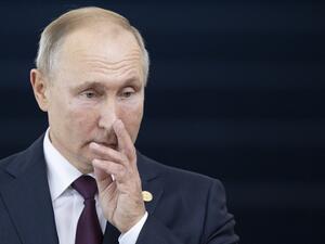 Russia's President Vladimir Putin gestures before the 11th BRICS Summit at the Itamaraty palace on November 14, 2019 in Brasilia, Brazil. Brazil's President Jair Bolsonaro walked a diplomatic tightrope, as he seeks to boost ties with Beijing and avoid upsetting key ally Donald Trump, on the eve of a summit with their BRICS counterparts from Russia, India and South Africa. Pavel Golovkin / POOL / AFP
