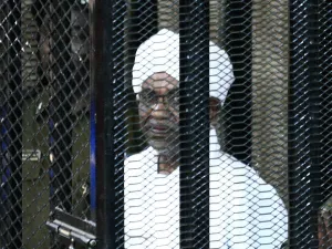 Sudan's ex-president Omar al-Bashir appears in court in the capital Khartoum on August 31, 2019 to face charges of illegal acquisition and use of foreign funds. The verdict in the corruption trial of Sudan's ousted president Omar al-Bashir is to be delivered on December 14. (AFP)