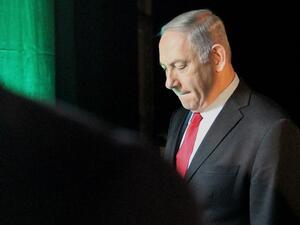 Israeli Prime Minister Benjamin Netanyahu leaves the Muni World conference in Tel Aviv. (AFP)