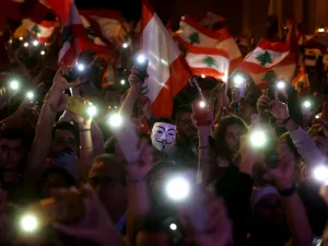 Lebanese demonstrators take part in a civilian Independence Day parade in Beirut's Martyr Square on November 22, 2019, more than a month into protests demanding an overhaul of the entire political system. (AFP/ File Photo)