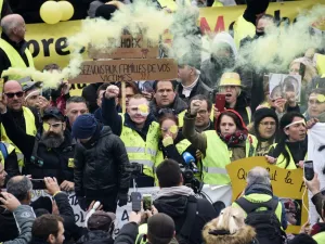 Manuel C., a "Yellow Vest" who was wounded in his left eye by a projectile likely shot by police during a "yellow vest" (gilets jaunes) demonstration on November 16, takes part alongside his wife, one of the movement's leading figures Jerome Rodrigues (3rd L) and other protesters in a march against police violence, on November 23, 2019, in the streets of Valenciennes, northern France. (AFP/ File Photo)
