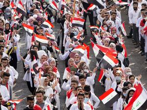 Iraqi engineering students take part in an anti-government demonstration in the southern city of Basra  (AFP)
