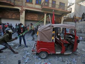 An Iraqi demonstrator uses a slingshot affixed to a tuk tuk car amid clashes with security forces in the capital Baghdad's al-Rasheed street near al-Ahrar bridge, on November 26, 2019, during ongoing anti-government demonstrations. (AFP/ File Photo)