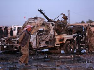 A picture taken on November 26, 2019 shows destroyed vehicles following a car bomb attack at a local market in the Turkish-held Syrian Kurdish town of Tel Hal along the border with Turkey in the northeastern Hassakeh province. (Nazeer Al-khatib / AFP)
