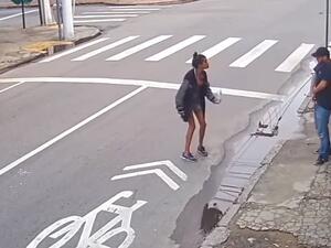 Dos Santos Leandro (center) apparently argued with de Castro (right) before he reached for a gun and shot her dead. (Video Screenshot)