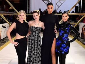 Kristen accessorised her look with a collection of chunky silver padlock