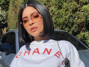 Kylie's ensemble featured a warm turtle-neck and long sleeves for the family celebration. 